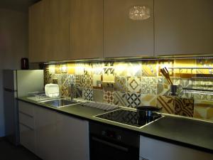 a kitchen with a sink and a counter top at Apartmány na hájovně in Jeseník