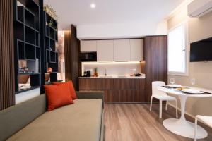 a living room with a couch and a table at Residence Lido di Dante in Lido di Jesolo