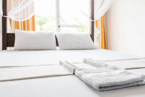 Ένα ή περισσότερα κρεβάτια σε δωμάτιο στο Cocoplant Surf Inn