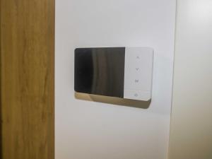 a microwave hanging on a wall in a room at Andreamar II in Cambados