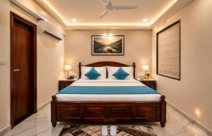 a bedroom with a bed and two tables and a window at Hotel Sugandh Retreat Near Bus Stand Jaipur in Jaipur