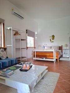 a living room with a couch and a table at Jay&Kay CosyRoom FlicEnFlac in Flic-en-Flac
