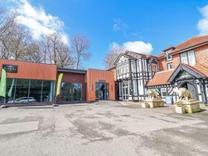 an empty parking lot in front of a building at Willerby Malton in Ruthin
