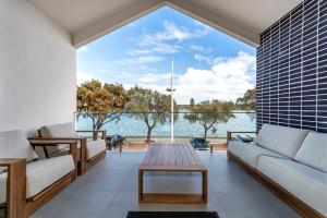 a living room with a view of the water at Hello Dolphins Villas in Mandurah