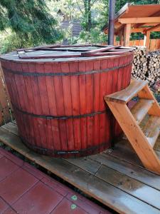 a large wooden barrel sitting on a picnic table at MATT'S House in Tuşnad