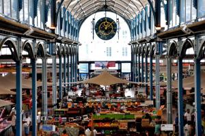 a large market with a clock in a building at Ibis budget Dijon Centre Clemenceau in Dijon