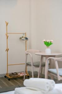 a table and two chairs and a table with a vase of flowers at Vinh Hy Horizon in Vĩnh Hy +47 photos