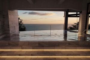 a view of the ocean from the balcony of a house at TAOYA Atami in Atami