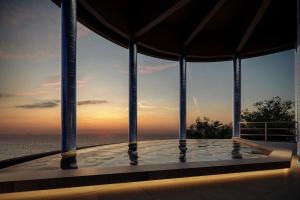 a swimming pool with a view of the ocean at TAOYA Atami in Atami