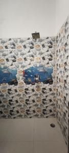 a wall with a bunch of shoes on it at La Buddha Villagers Homestay - Near Taj Mahal Agra in Agra +43 photos