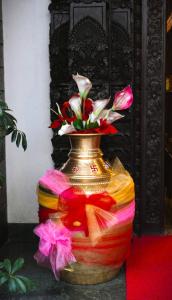 a colorful vase with flowers in it at Kathmandu Business Hotel in Kathmandu +69 photos