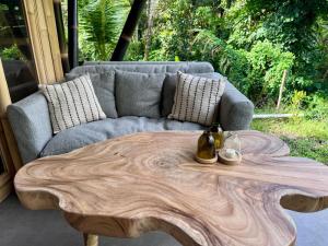 a living room with a couch and a wooden coffee table at Sweet Escape - Boutique Hotel in Sidemen +39 photos