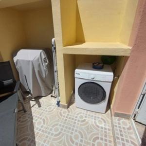 a washer and dryer in a small room at CASA LUTHI Costa Blanca in Orihuela Costa