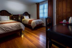 Ένα ή περισσότερα κρεβάτια σε δωμάτιο στο Illa Hotel