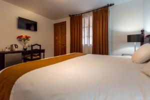 Ένα ή περισσότερα κρεβάτια σε δωμάτιο στο Illa Hotel