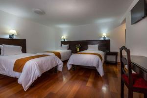 Ένα ή περισσότερα κρεβάτια σε δωμάτιο στο Illa Hotel