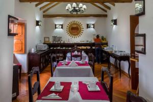 a dining room table set for a party at Illa Hotel in Cusco