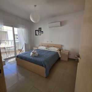 a bedroom with a bed with a stuffed animal on it at Obv 2-303 in Pyla +20 photos