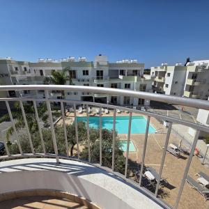 a view of the pool from the balcony of a apartment at Obv 2-303 in Pyla
