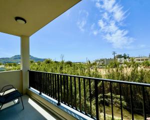 a balcony with a view of the beach at Celene Luxury Plakias in Plakias