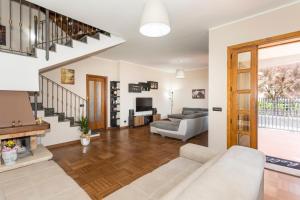 a living room with a couch and a fireplace at Il Vulcano di Milo in Milo