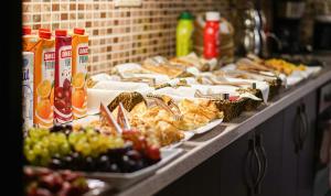 a buffet with many plates of food on a table at Eskibağ Butik Hotel in Buyukada +56 photos