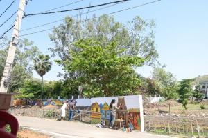 a group of people standing in front of a mural at Hotel The Mount View in Rājgīr +8 photos