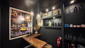 a bar with a counter and some bottles of alcohol at Dejavu Terrace Setúbal in Setúbal +21 photos