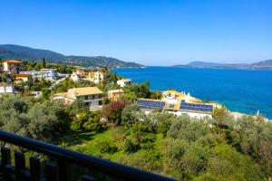 a view of a town and the ocean at Zen Villas in Nikiana