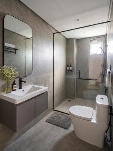 a bathroom with a toilet and a sink and a shower at SOLÉA Boutique Hotel & Spa- SaiGon in Ho Chi Minh City