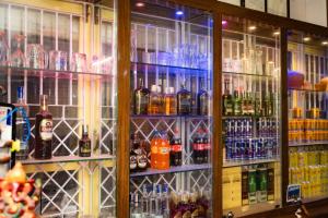 a bar with a lot of bottles of alcohol at Tokyo Hotel in Kathmandu