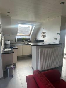a kitchen with a large island in a room at de Zeester in Bredene-aan-Zee