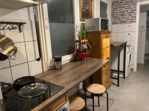 a kitchen with a counter top and a stove top oven at The Rusty Corner in Solingen