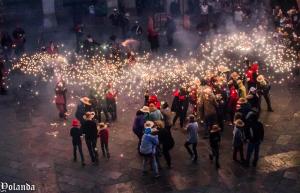 a crowd of people with lights in the street at Mar Blau Estartit Rental in L'Estartit +60 photos