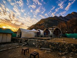 a group of tents in front of a mountain at Vintage Vista Camps in Kasol +34 photos