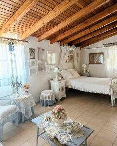 a large room with two beds and a table at Sophy's Cottage in Politika