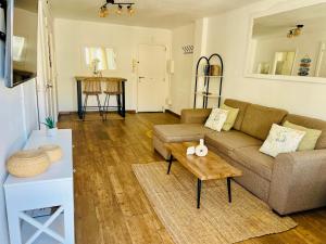 a living room with a couch and a coffee table at Puerto de Pollença - Beach and Center,Happy Mar in Port de Pollensa