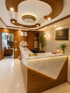 a lobby of a hotel with a reception counter at Hotel Royal Blue in Modāsa