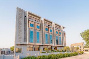 a rendering of a building with blue windows at Hotel Chand Ratan Palace By Travinities in Bikaner