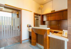 a kitchen with a counter and a sink in a room at Hotel Chand Ratan Palace By Travinities in Bikaner