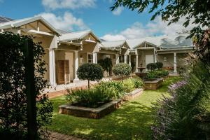 a house with a garden in front of it at Highlands House in Harare