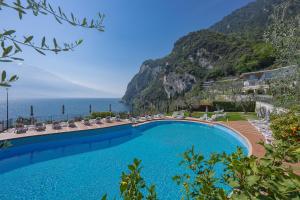 a swimming pool with a view of the ocean at Hotel Atilius - Adults Only in Limone sul Garda +31 photos