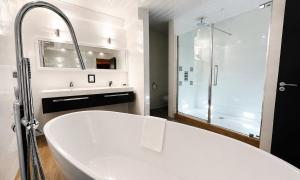 a white bathroom with a tub and a shower at The Popinjay Hotel in Larkhall +58 photos