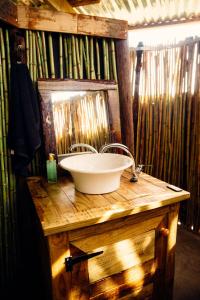 a bathroom with a sink and a mirror at Nama-Qua Game Reserve in Vredendal +26 photos
