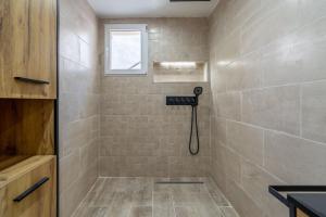 a bathroom with a shower with a sink and a window at Port-la-Nouvelle 4p in Port-la-Nouvelle +16 photos