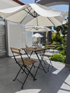 a group of tables and chairs with umbrellas at Row 7 Holiday Homes in Kyrenia +15 photos