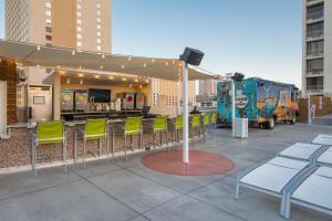 a group of chairs on a patio with a food truck at Plaza Hotel & Casino in Las Vegas