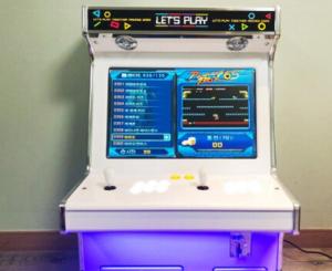 a lottery machine with a screen on top of it at Daecheon Mud Gongju Pension in Boryeong