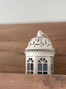 a small toy house with a bird on top of it at Victoria City View in Victoria
