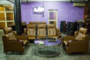 a waiting room with a bunch of chairs and a table at Emglo Suite in Lagos